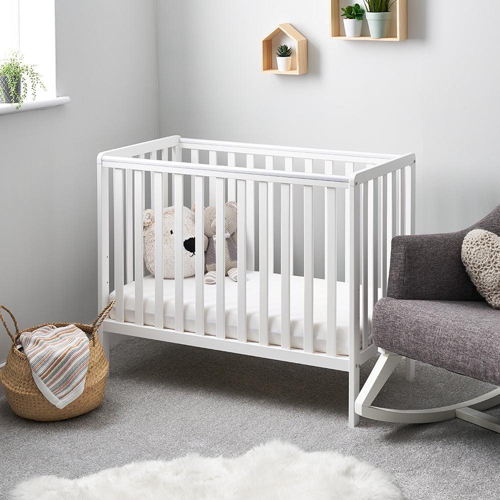 White wooden baby crib.