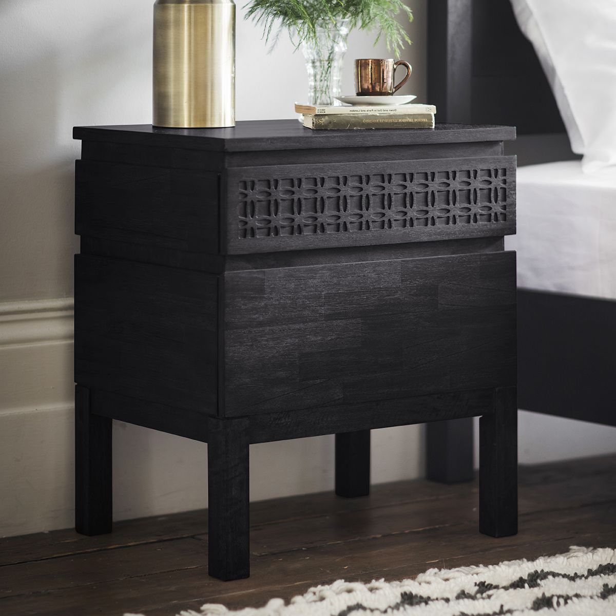 Black wooden nightstand with two drawers.