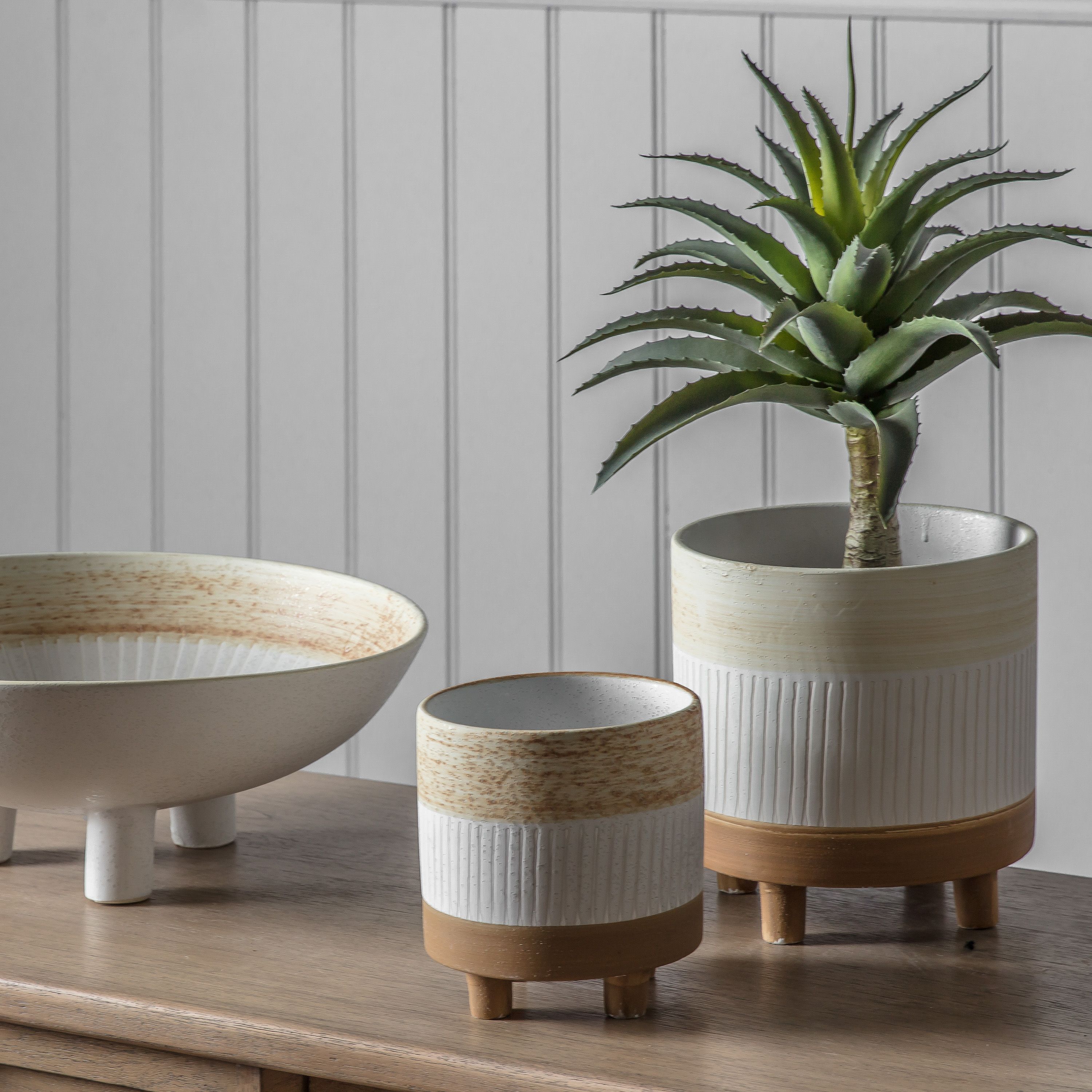 Decorative ceramic planters and bowl.