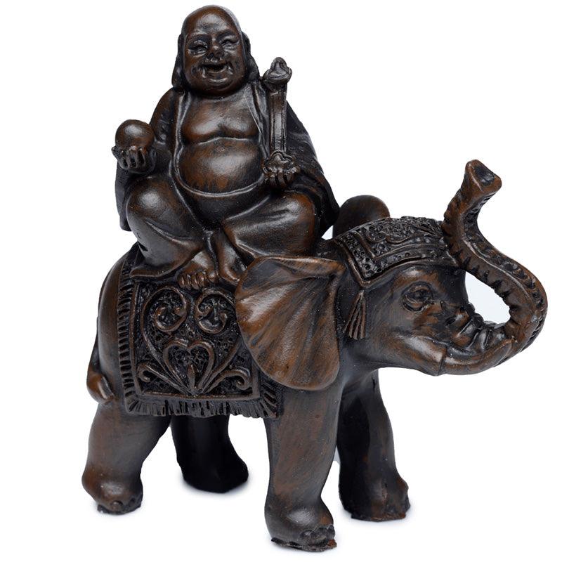 Bronze-colored Buddha riding an elephant statue.