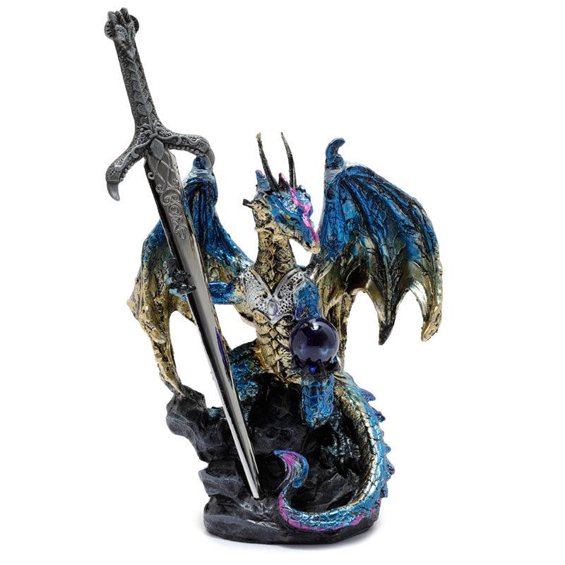 Dragon statue with sword and orb.