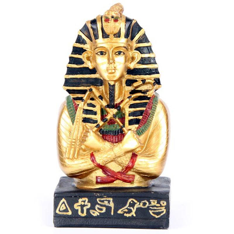 Golden pharaoh bust with hieroglyphic base.